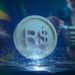 moneda de Real digital sobre plataforma digital con bandera de brasil y evaluador en el fondo