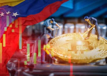 Mineros trabajando en minería de bitcoin junto a bandera de Venezuela.