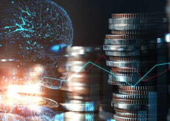monedas apiladas junto a inteligencia artificial