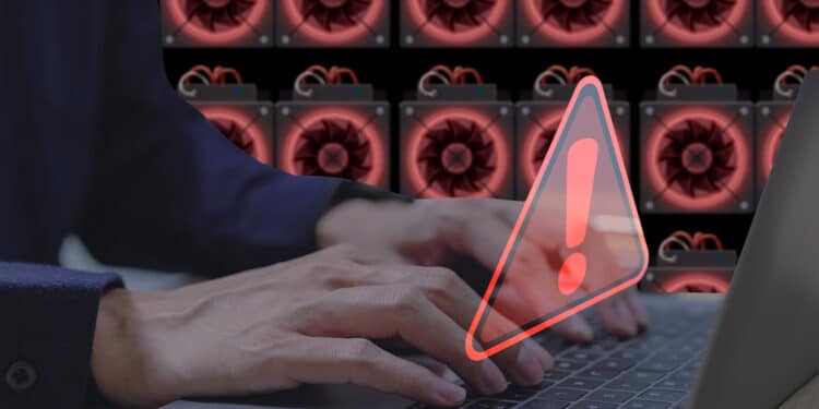 Computadora con advertencia de malware y mineros al fondo.