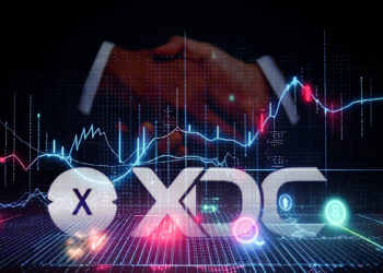 logo de XDC entre grafico de precio y dos personas estrechando sus manos