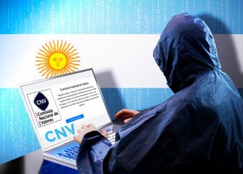 Hacker hackeando CNV junto a bandera de Argentina de fondo.