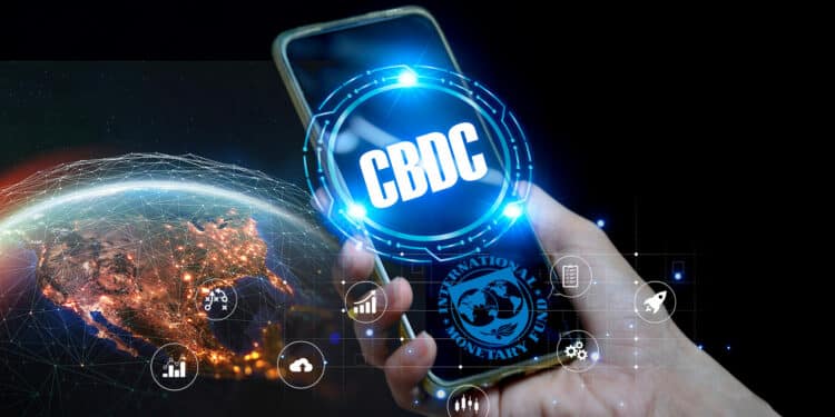 Celular con CBDC y logo de FMI junto al planeta tierra.