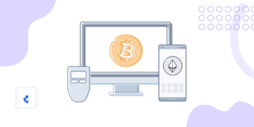 Una pantalla con un bitcoin, un móvil con un ethereum y una figura de trezor para simular las wallets de Bitcoin.