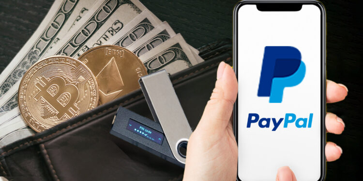 telefono con logo de paypal en pantalla, ledger wallet, monedas de bitcoin ethereum y billetes de dólares en el fondo