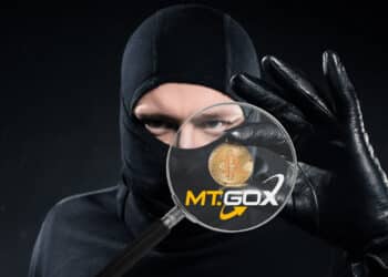 Ladrón robando bitcoin y logo de MT.GOX