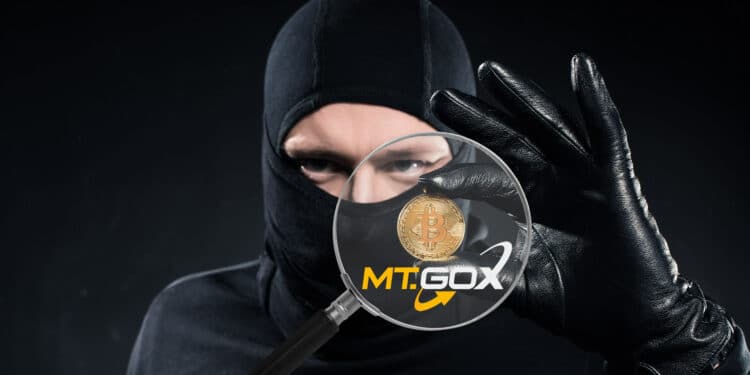 Ladrón robando bitcoin y logo de MT.GOX