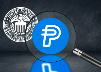 Criptomoneda de Paypal y logo de la FED.