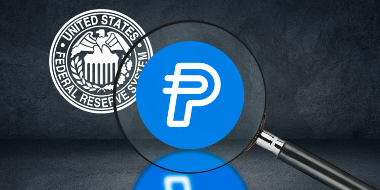 Criptomoneda de Paypal y logo de la FED.
