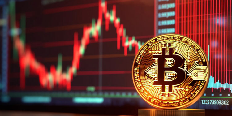 moneda de bitcoin con grafico de precio en baja al fondo