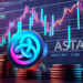 moneda de Astar sobre monedas apiladas con grafico de precio en pantalla en el fondo