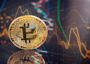 moneda de bitcoin entre graficos de precio