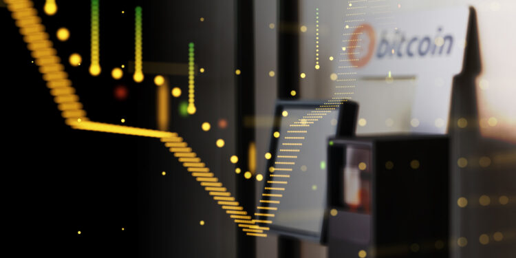 grafico en desceso con cajero automatico de bitcoin en el fondo