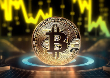 moneda de bitcoin en plataforma con grafico de precio en dorado en el fondo