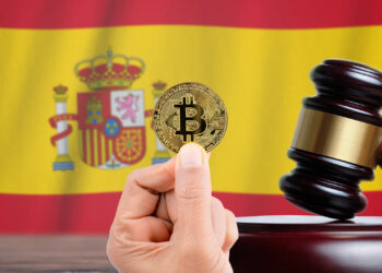 Bitcoin y bandera de España.