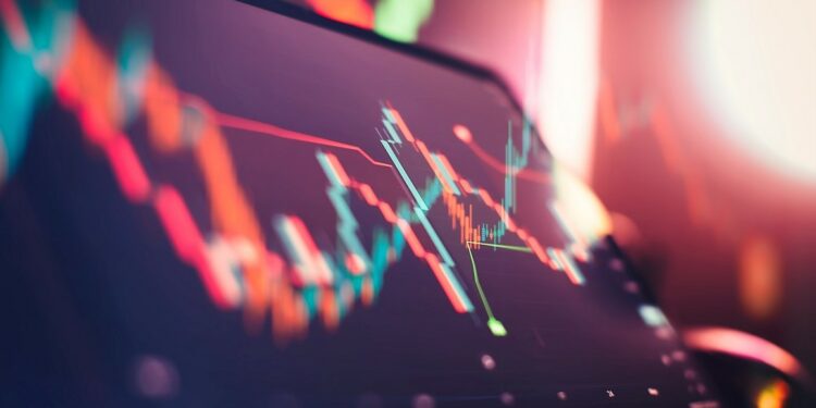 gráficos de precios frente a una pantalla de computadora