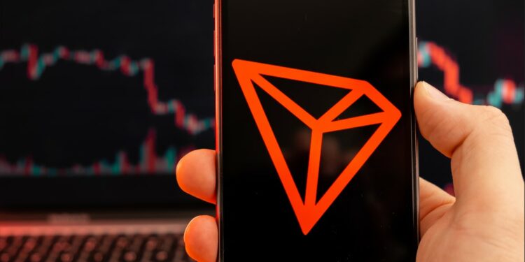 Símbolo de Tron en un celular