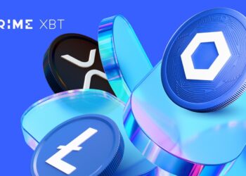 Monedas de XRP, Litecoin y bitcoin al lado del logo de Prime XBT.