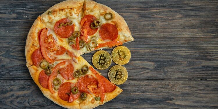 Una pizza millonaria que marcó la historia. Fuente: Serenkonata/ Adobe Stock,