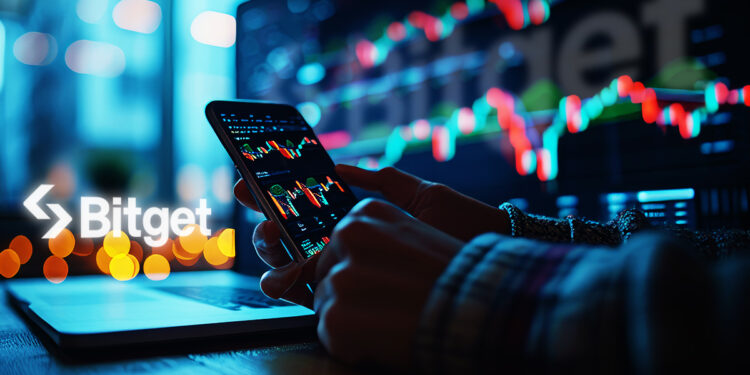 Un teléfono con gráficos de trading y el logo de Bitget al fondo