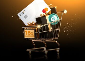 Tarjeta de debito y bolsas de compra en carro de compras.