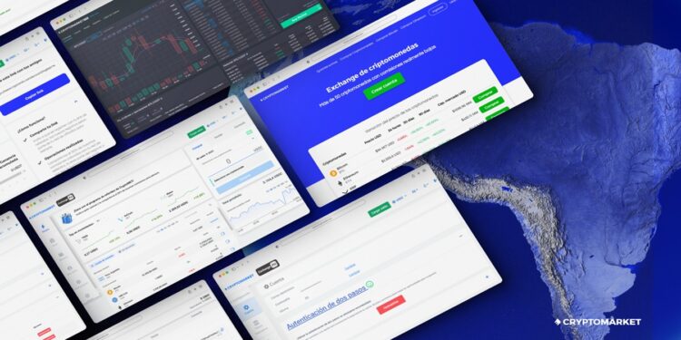 Grupo de pantallas de computadoras sobre una superficie azul.