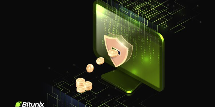 Computadora verde con escudo de seguridad y monedas.