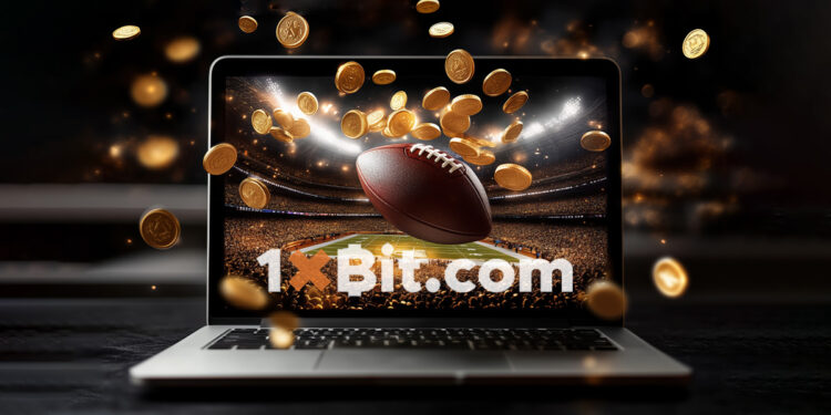 criptomonedas cayendo en frente computadora sobre mesa de madera, transmitiendo juego deportivo de futbol americano en pantalla y balon sobresaliendo de la pantalla