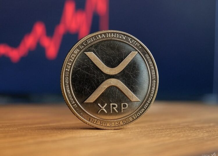 Una moneda con el logo de XRP apoyada sobre una mesa.