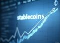 gráfico azul con la palabra stablecoins y un logo de Ethereum.