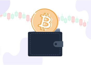 Un monedero con un bitcoin y gráficas de precio.