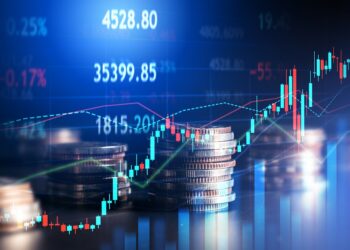 gráficos de precios y monedas una encima de otra.