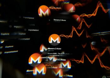 Logo de monero y gráficos de precio.