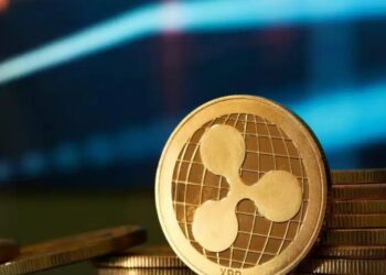 Una moneda dorada con el logo de Ripple Labs.