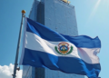 Imagen creada con IA que refleja una torre con la palabra Tether en la cima y la bandera de El Salvador en primer plano.
