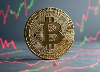 Bitcoin con gráficas en rojo y verde en el fondo.