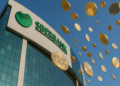 Monedas de bitcoin cayendo desde el banco Sberbank.