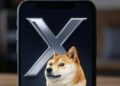 Un celular con el logo de X y un perro shiba inu.