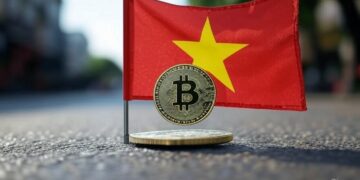 Una bandera de Vietman junto a una moneda de bitcoin.