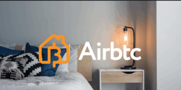 Un cuarto de hotel con el logo de la plataforma Airbtc, como Airbnb, pero con bitcoin.