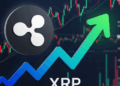 Moneda de XRP y un gráfico que va al alza.