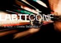 logo de LABITCONF en Buenos Aires sobre moneda de bitcoin estatica sobre fondo con luces difusas