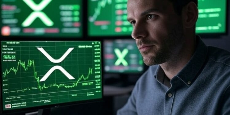 Un inversionista junto a pantallas con gráficos de precio de XRP.