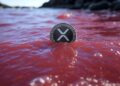 Una moneda de XRP en medio de una marea roja.
