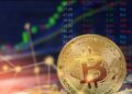 Bitcoin con gráficas de fondo.