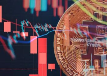 Bitcoin con gráficas rojas alrededor.