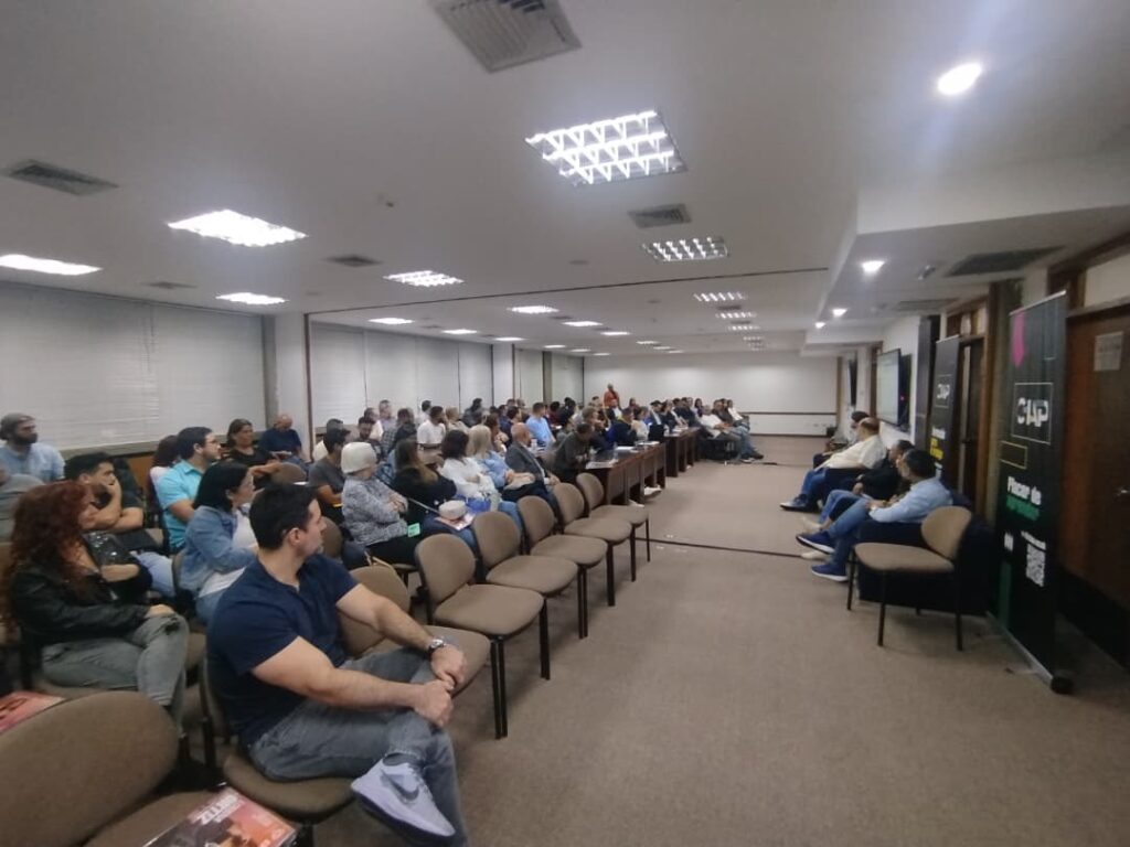 group of students participate in a class on communication and bitcoin with a panel of experienced journalists
