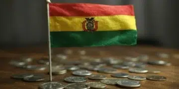 Bandera de Bolivia sobre varias monedas.