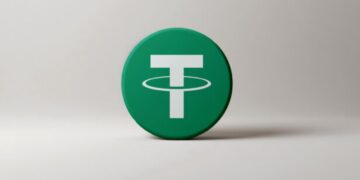 Moneda física de USDT con un fondo blanco.