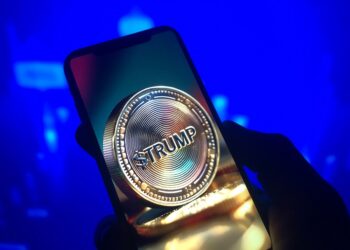 Teléfono con la memecoin TRUMP en su pantalla.